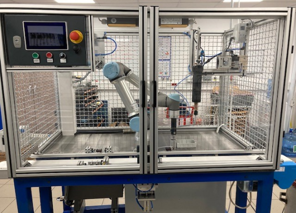 Automated machine applying adhesive in an enclosed cell